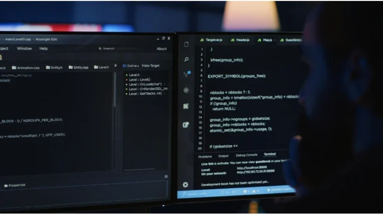 Specialist at a computer evaluating an online gaming software supplier